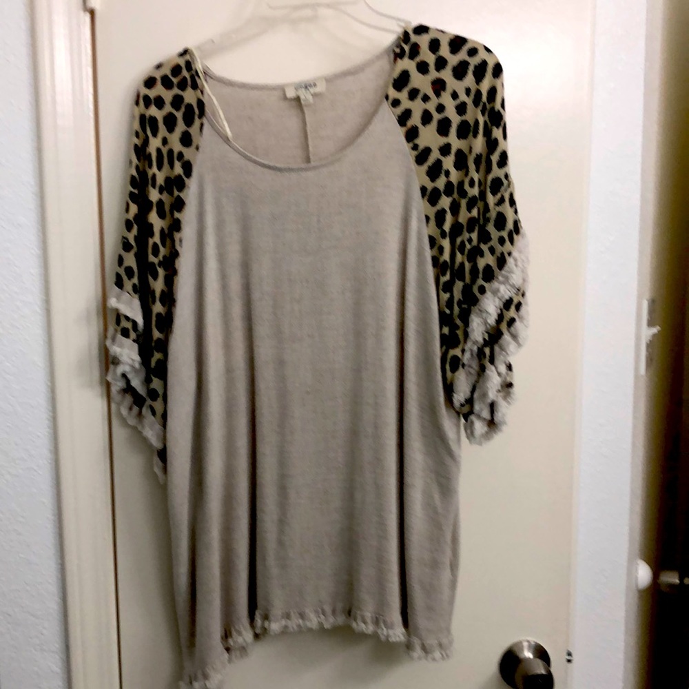 Women classy or casual top. Size large Tan color with Cheetah print sleeves